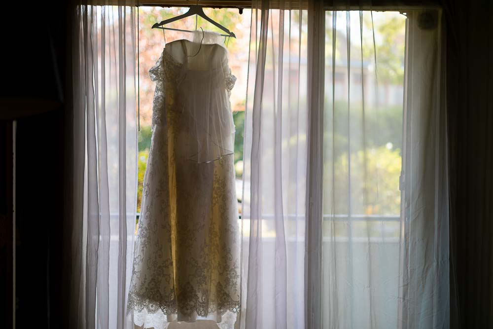 Photographe shooting mariage preparatifs robe
